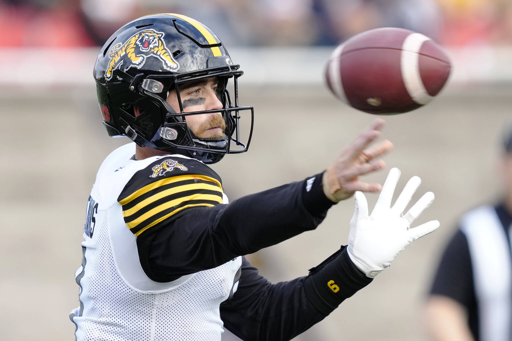 Hamilton Tiger-Cats quarterback Dane Evans (9) makes a pass during second quarter CFL Eastern semi-final football action against the Montreal Alouettes on Sunday, November 6, 2022 in Montreal. THE CANADIAN PRESS/Paul Chiasson