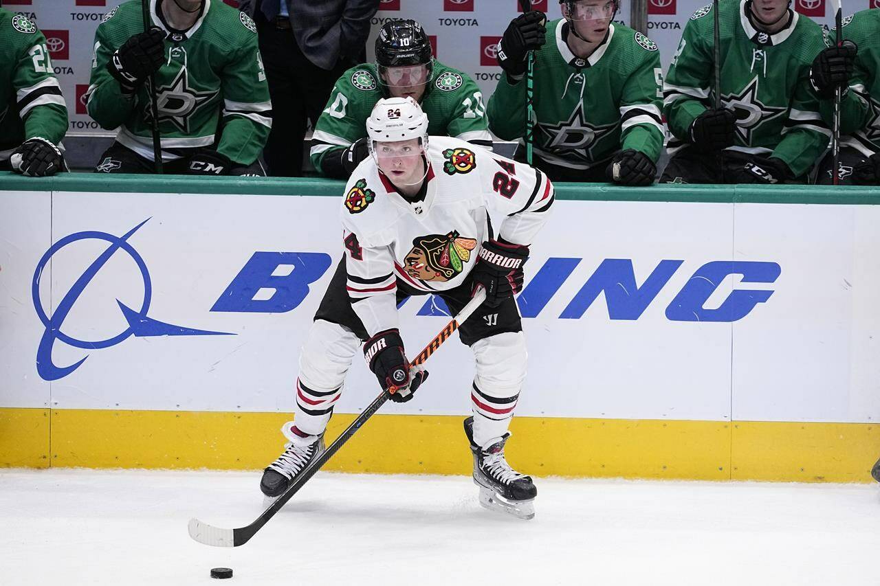 FILE - Chicago Blackhawks center Sam Lafferty prepares to make a pass during an NHL hockey game against the Dallas Stars, Wednesday, Feb. 22, 2023, in Dallas. The Toronto Maple Leafs acquired forward Sam Lafferty and defenseman Jake McCabe from Chicago, Monday, Feb. 27, 2023, their latest big trade that comes in the aftermath of division-rival Tampa Bay making another pre-deadline splash.(AP Photo/Tony Gutierrez, File)