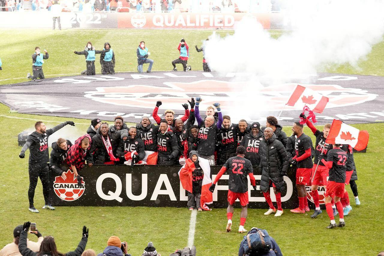 Canada players celebrate their win following second half CONCACAF World Cup soccer qualifying action against Jamaica, in Toronto on Sunday, March 27, 2022. Qualifying in the CONCACAF region for the 2026 World Cup will kick off in March 2024 with co-hosts Canada, the U.S. and Mexico watching from the sidelines. THE CANADIAN PRESS/Nathan Denette