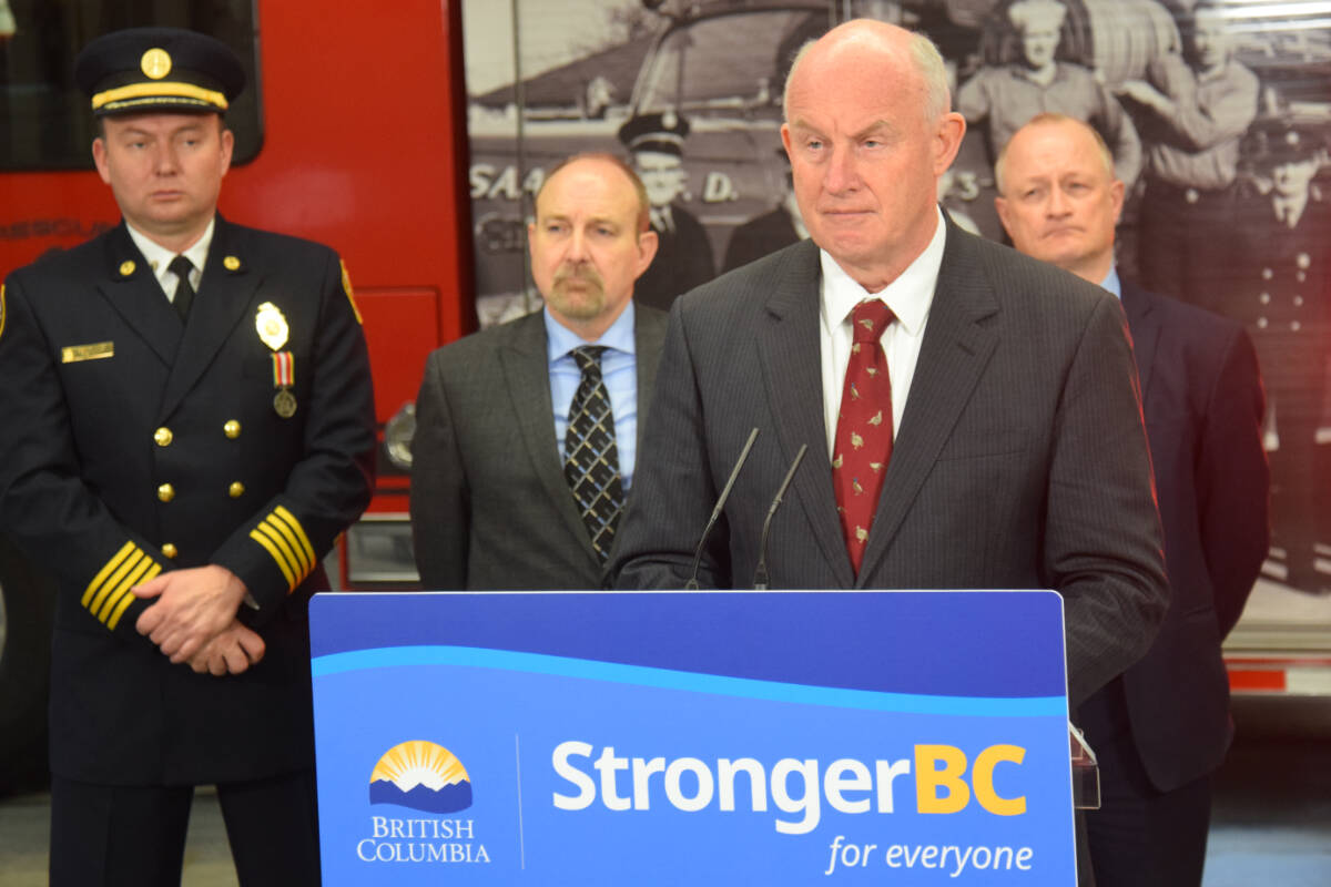 Public Safety Minister Mike Farnworth announces B.C.’s $150-million investment to fund upgrades to province’s 911 emergency communication system during a press conference at a fire hall in the Vancouver Island community of Saanich. (Austin Westphal/News Staff)