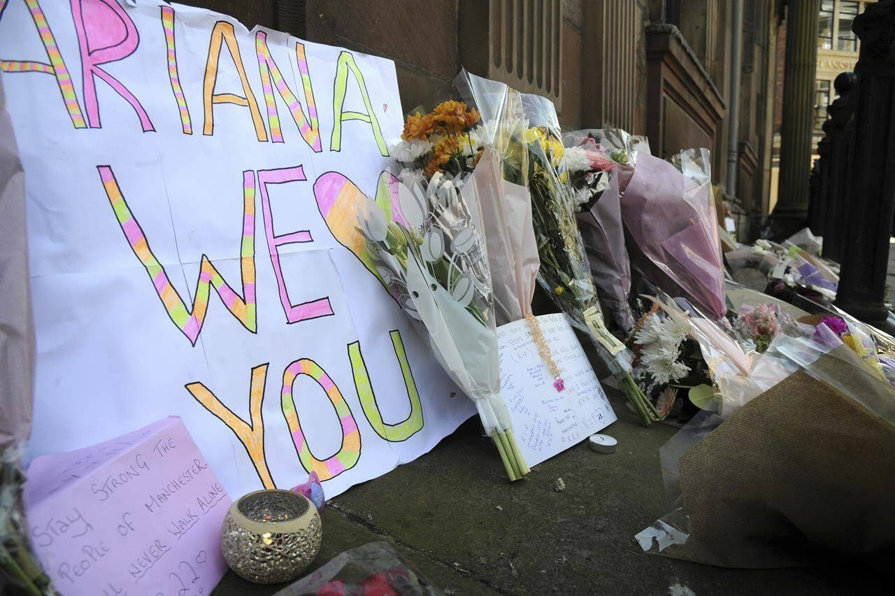 FILE - Flower tributes at St Ann’s square, Manchester, England, on May 23, 2017, after a suicide bombing attack at an Ariana Grande concert at the Manchester Arena. Britain’s domestic intelligence agency didn’t act swiftly enough on key information and missed a significant opportunity to prevent the suicide bombing that killed 22 people at a 2017 Ariana Grande concert, an inquiry found Thursday, March 2, 2023. (AP Photo/Rui Vieira, File)