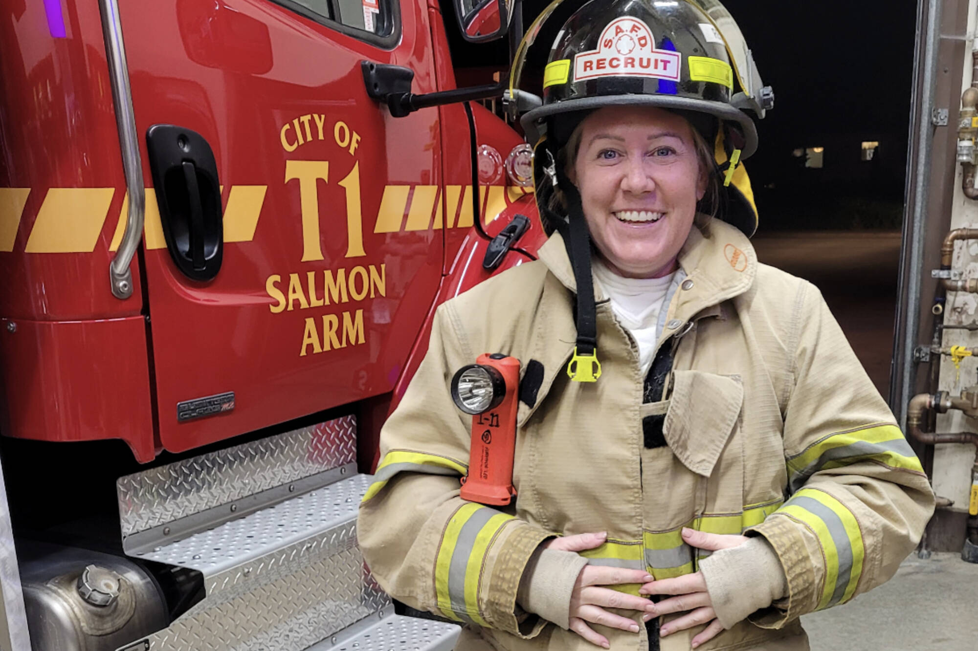 Tammy Young beams with excitement when she returns from her first call with the Salmon Arm Fire Department. (Photo contributed)