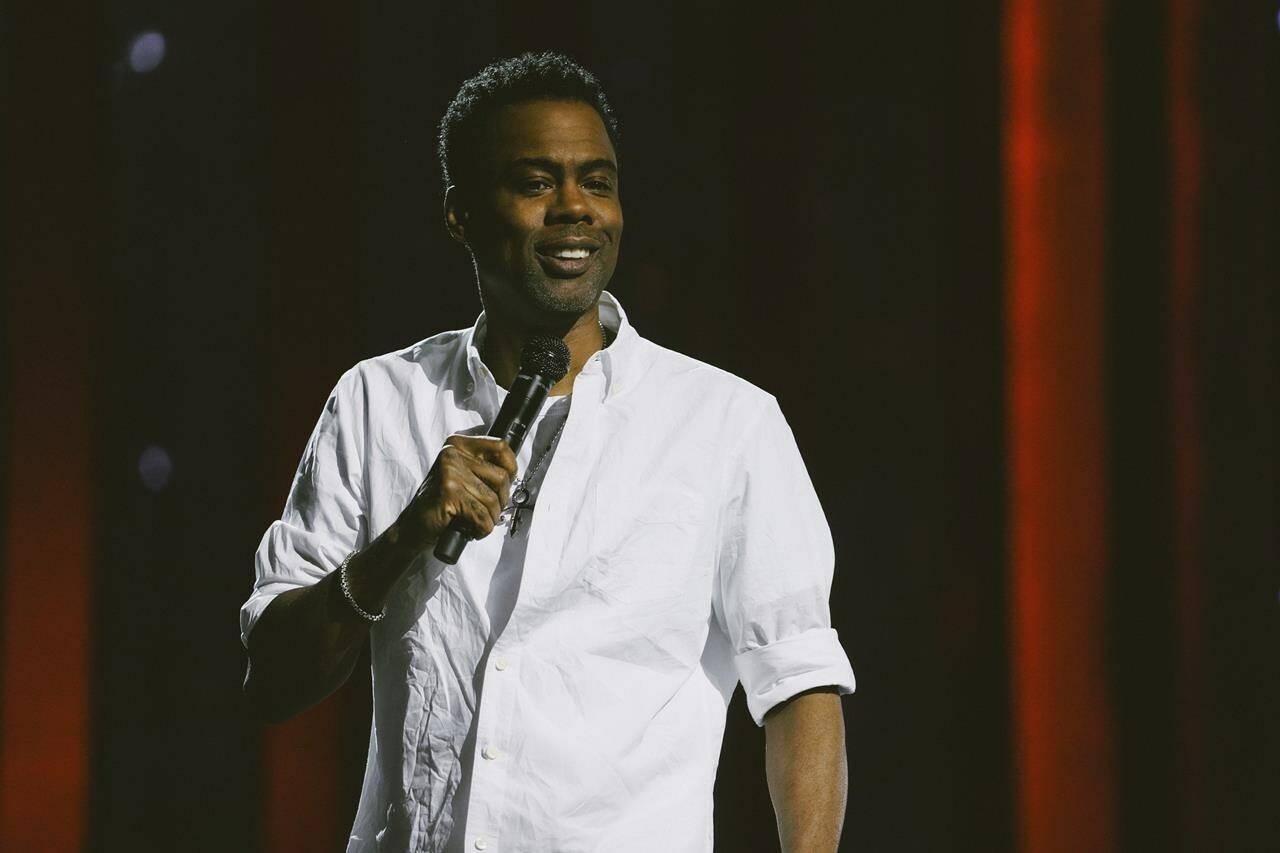 This image released by Netflix shows Chris Rock during a performance his comedy special “Chris Rock: Selective Outrage” at the Hippodrome Theater in Baltimore, Md. (Kirill Bichutsky/Netflix via AP)