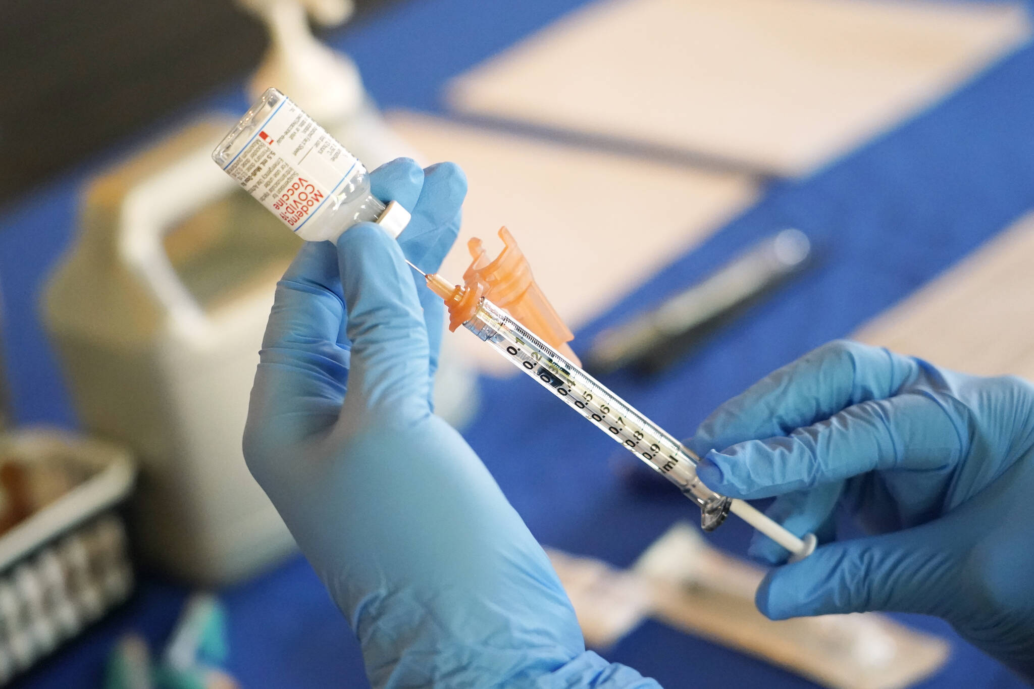 A nurse prepares a syringe of a COVID-19 vaccine at an inoculation station in Jackson, Miss., July 19, 2022. (AP Photo / Rogelio V. Solis)