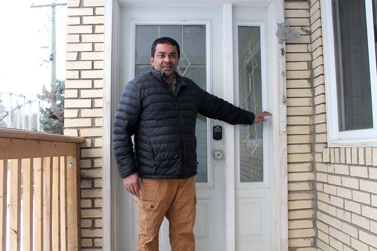 Sam Perera shows the high water mark from the November 2021 flood at his front door on Fenchurch Avenue. (Andrea DeMeer/The Similkameen Spotlight)