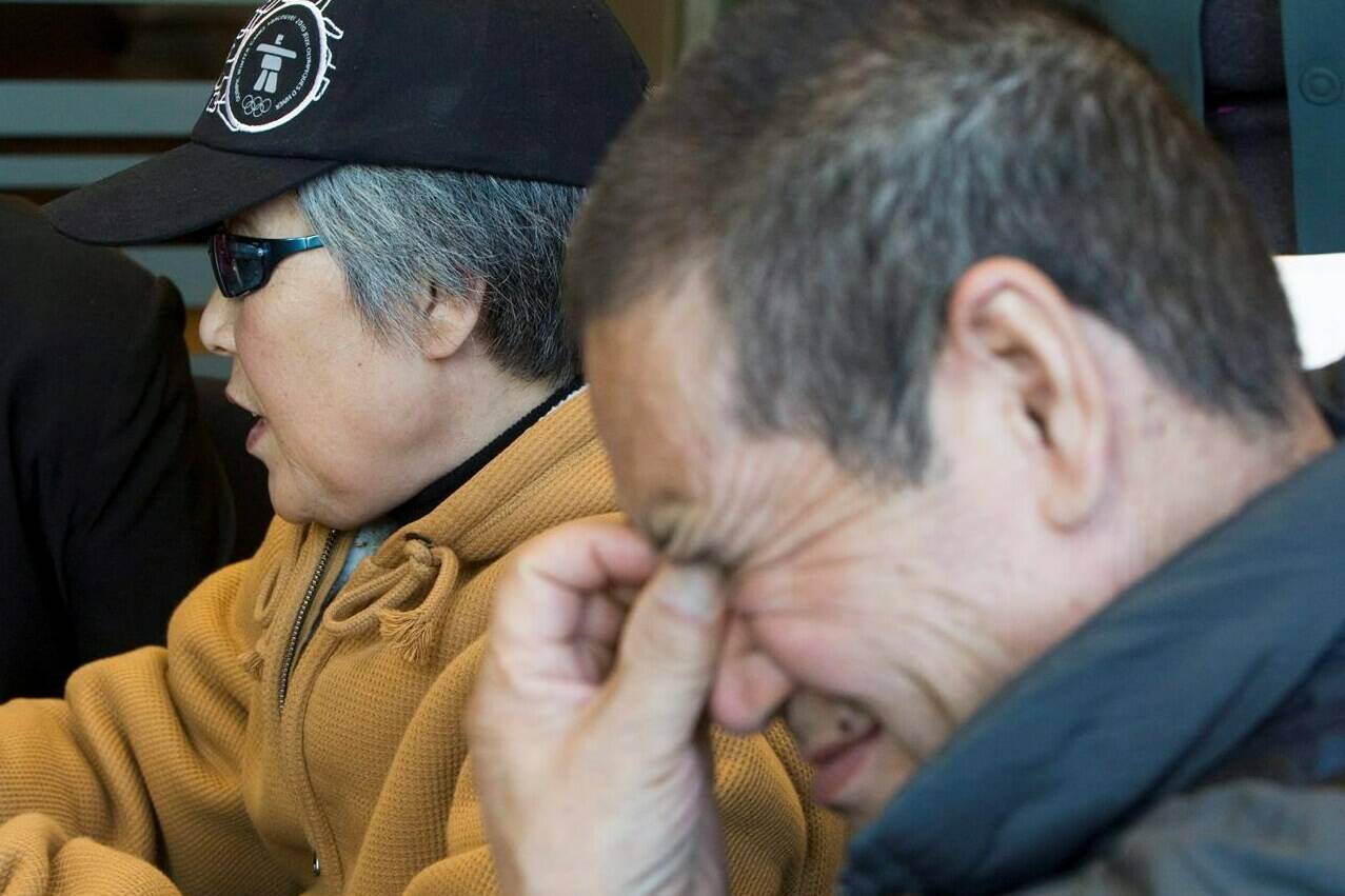 Murder victim Amanda Zhao’s mother Baoying Yang (left) and father Zisheng Zhao pause for a moment during a news conference in Vancouver, Monday, Oct. 20, 2008. THE CANADIAN PRESS/Jonathan Hayward
