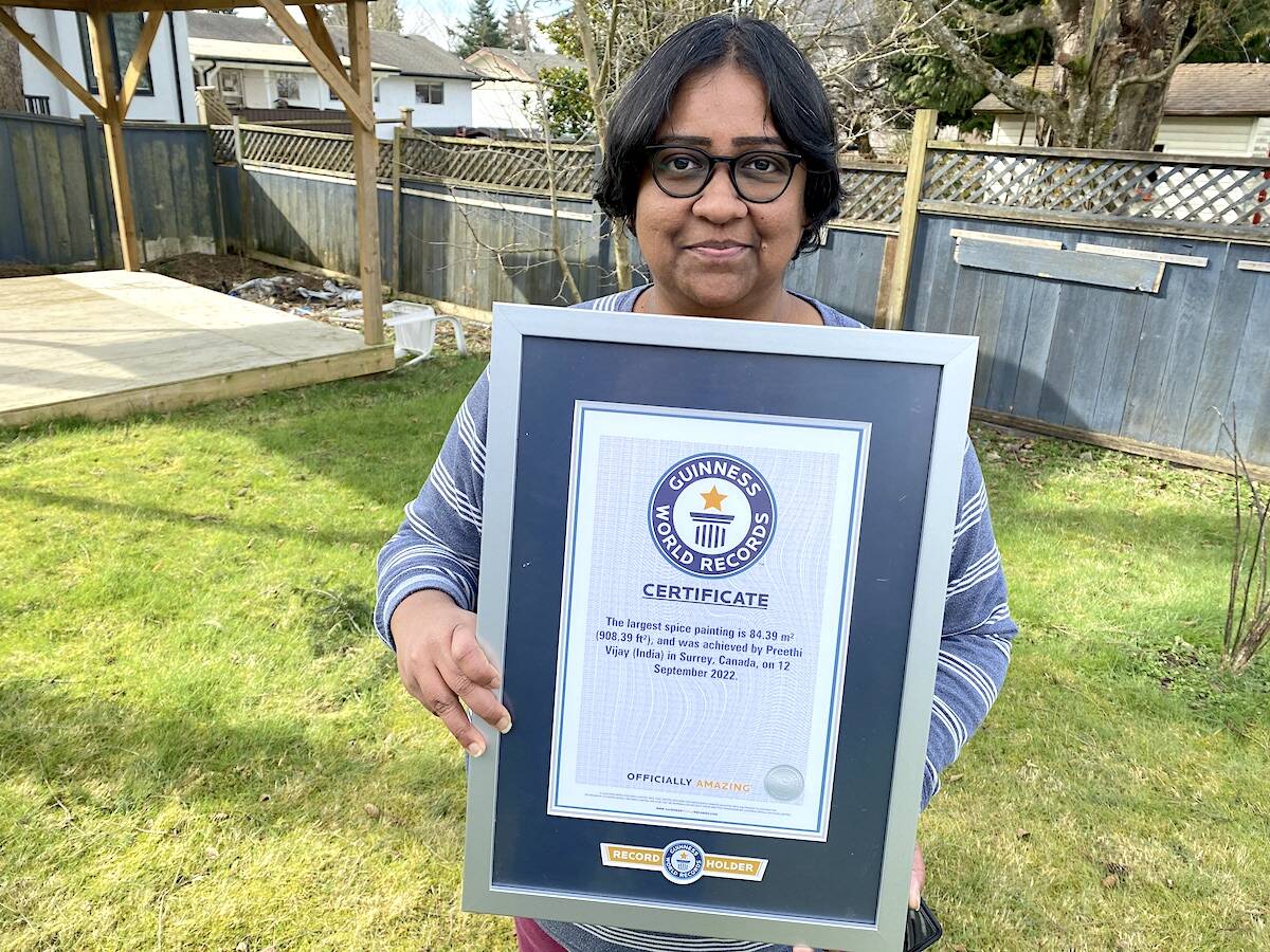 Surrey resident Preethi Vijay with her Guinness certificate for the world’s largest spice painting. (Photo: Tom Zillich)