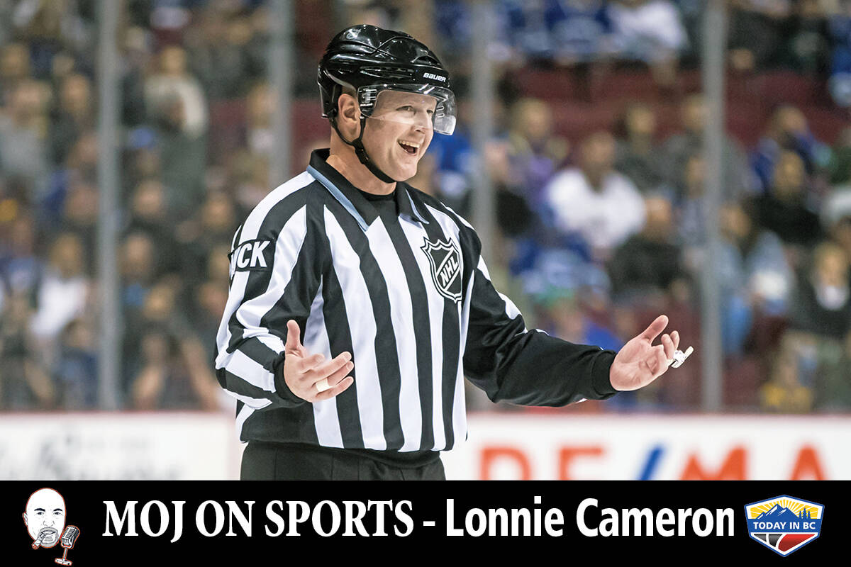 Linesman Lonnie Cameron, who was honoured before the game for working his 1,500th NHL game laughs as the Vancouver Canucks and Anaheim Ducks play during first period NHL hockey action in Vancouver, on Monday February 25, 2019. (THE CANADIAN PRESS/Darryl Dyck)