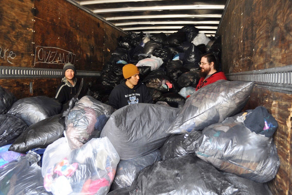 Positive Apparel Thrift Store employees load a semi-trailer with bags of old clothes, which every three weeks makes deliveries from Nelson to a recycling facility in Vancouver. There is nowhere in the Kootenays to recycle textiles. Photo: Tyler Harper