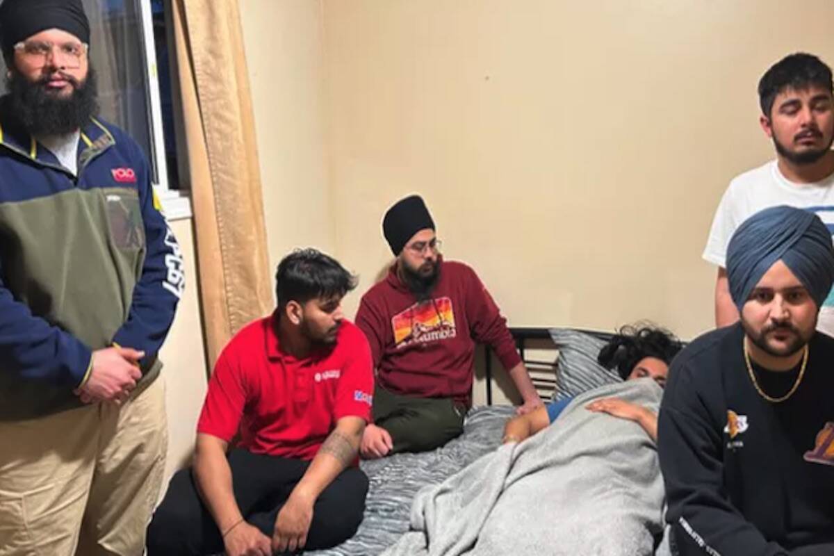 Gagandeep Singh, 21, surrounded by friends after being attacked at a bus stop in Kelowna in March 2023. (GoFundMe)