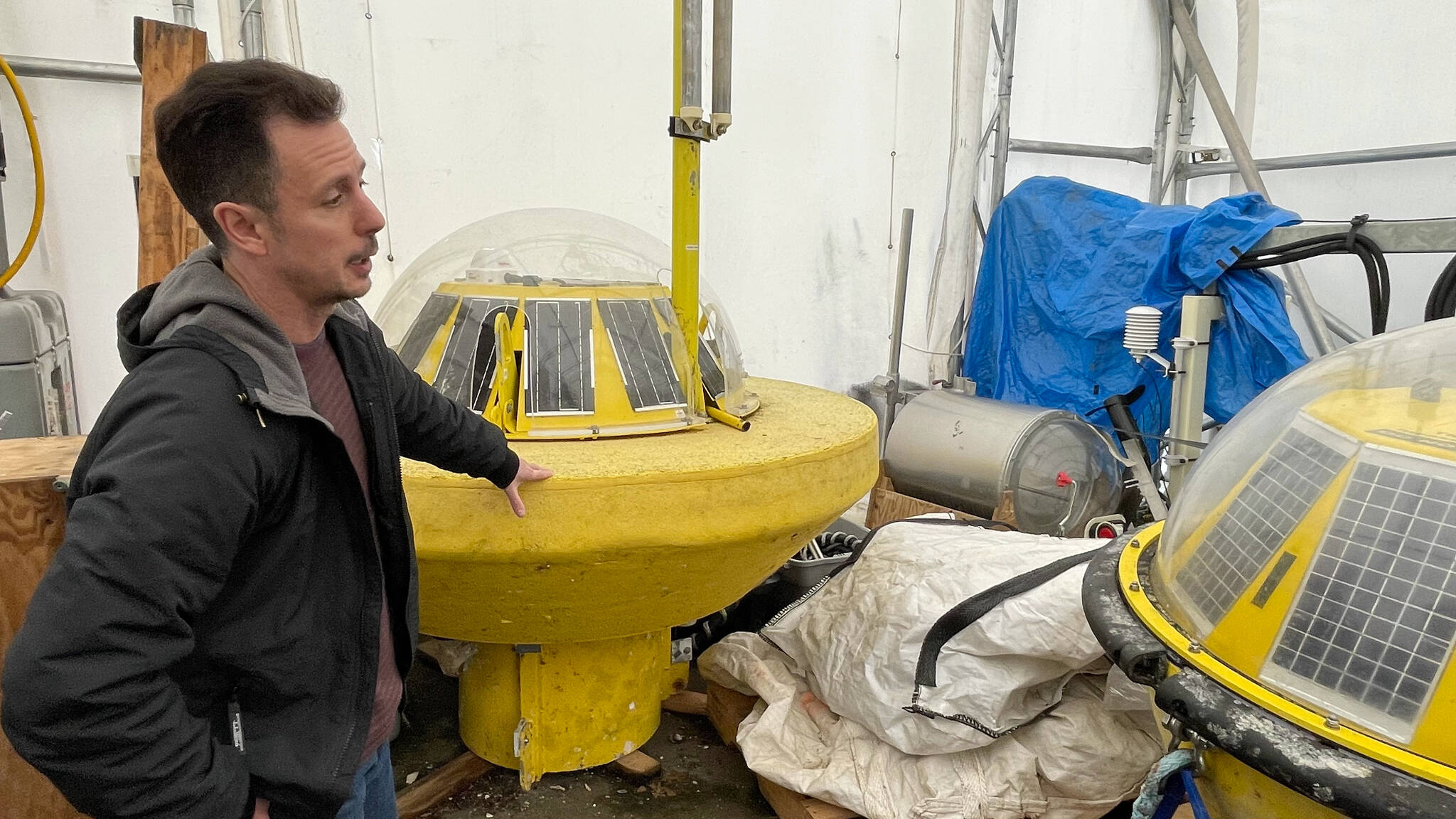Ben Whitby shows a similar type of buoy-based wave data collection platform to the one that will be deployed in the waters off Yuquot at the University of Victoria’s Pacific Regional Institute for Marine Energy Discovery (PRIMED) lab in North Saanich March 3. (Austin Westphal/News Staff)