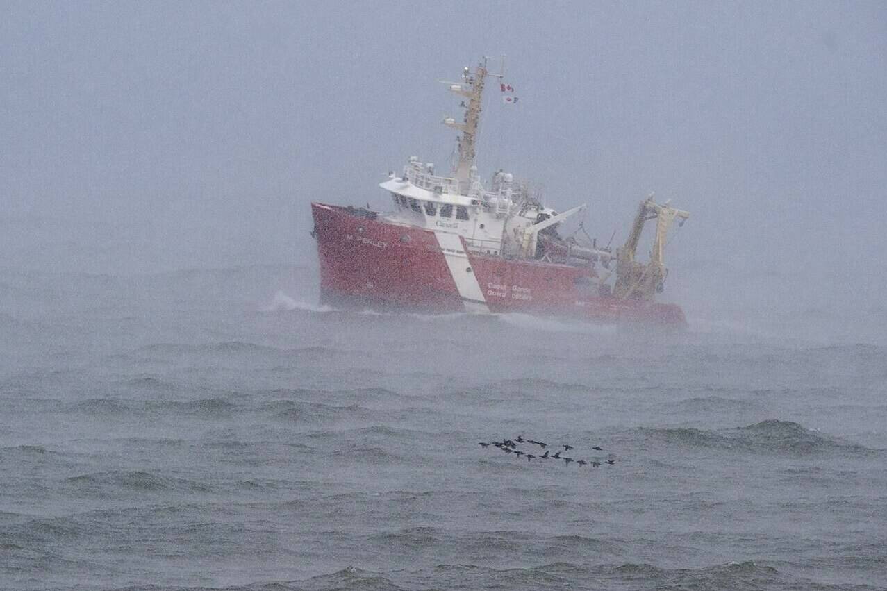 The CGGS M. Perley searches the waters of the Bay of Fundy in Hillsburn, N.S. on Wednesday, Dec. 16, 2020 as they continue to look for five fishermen missing after the scallop dragger Chief William Saulis sank in the Bay of Fundy. THE CANADIAN PRESS/Andrew Vaughan