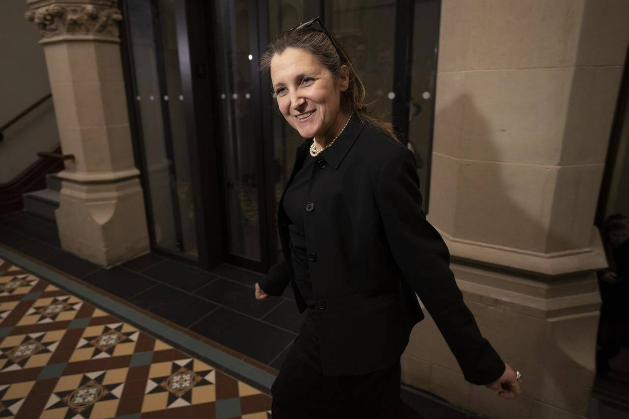 Deputy Prime Minister and Finance Minister Chrystia Freeland speaks briefly with reporters as she makes her way to a cabinet meeting, Tuesday, February 14, 2023 in Ottawa. THE CANADIAN PRESS/Adrian Wyld