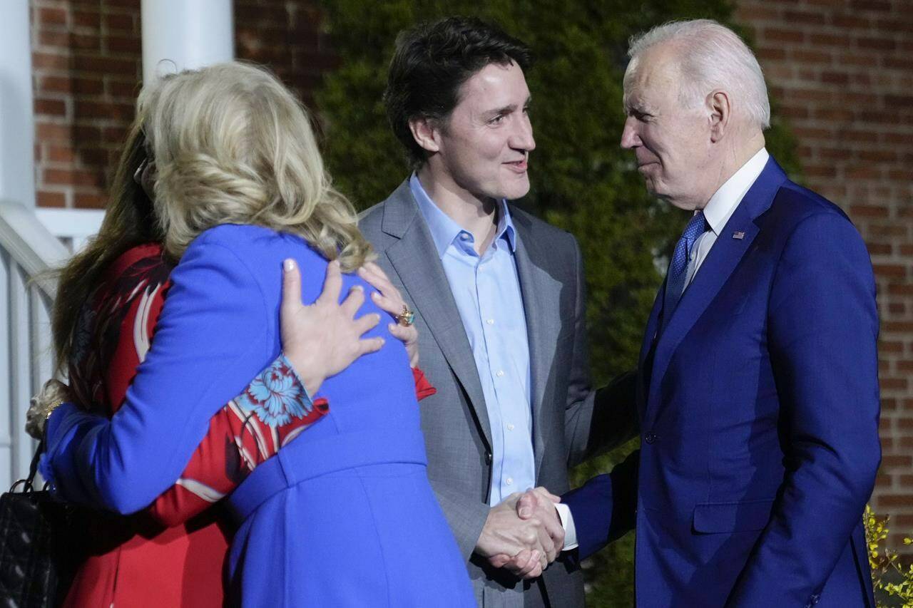 President Joe Biden and first lady Jill Biden are greeted by Canadian Prime Minister Justin Trudeau, second from right, and his wife Sophie Gregoire Trudeau, left, at Rideau Cottage, Thursday, March 23, 2023, in Ottawa, Canada. (AP Photo/Andrew Harnik)