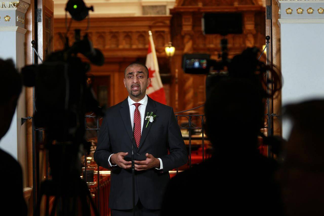 Then-Minister of Jobs, Economic Recovery and Innovation Ravi Kahlon answers questions from members of the media at the legislature in Victoria, B.C., on Monday, Feb. 6, 2023. The British Columbia government says it will be providing 330 new homes for people living on Vancouver’s Downtown Eastside by the end of June. THE CANADIAN PRESS/Chad Hipolito