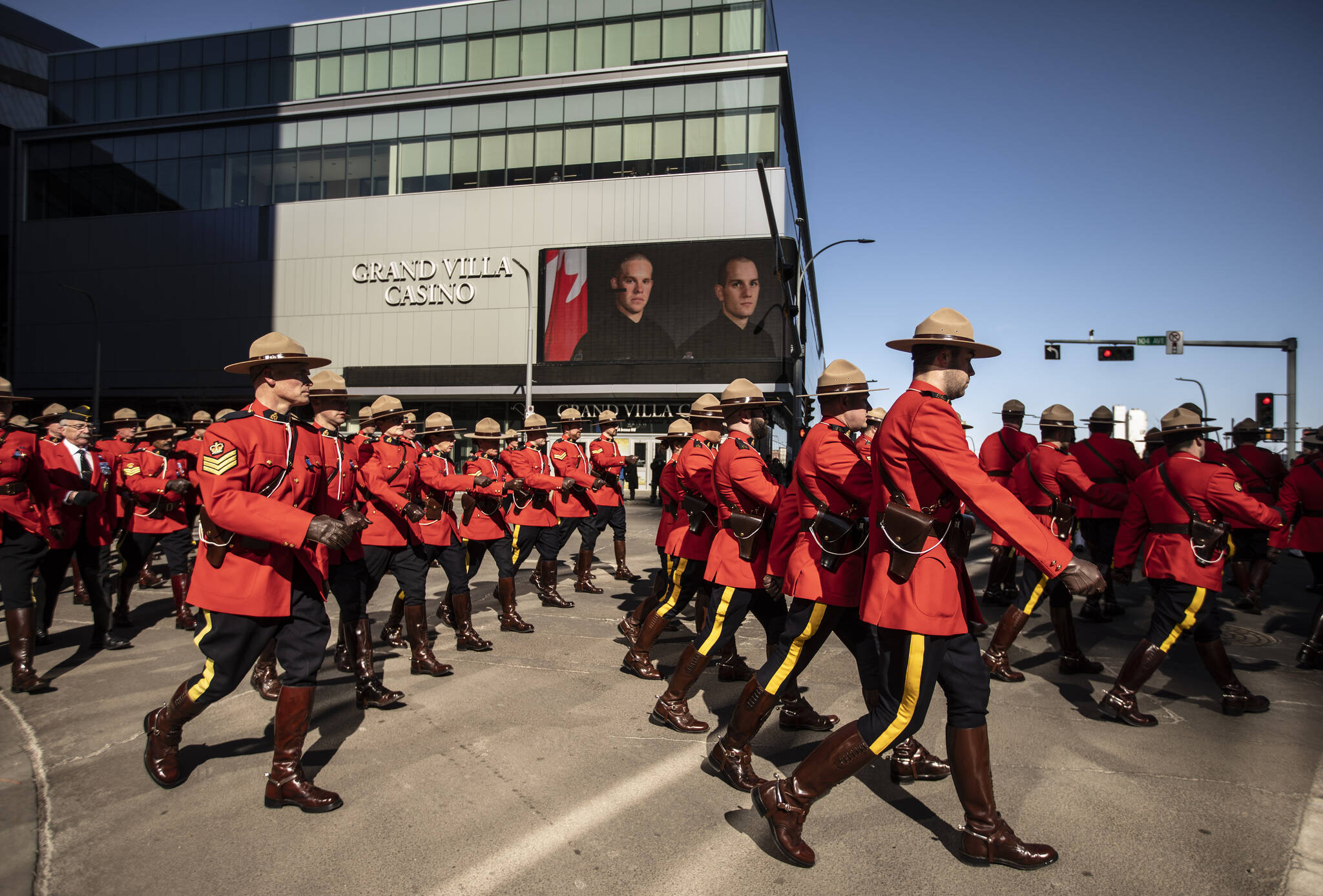RCMP march during the procession for Edmonton Police Service constables Travis Jordan and Brett Ryan in Edmonton, Monday, March 27, 2023. The officers were killed in the line of duty on March 16, 2023. THE CANADIAN PRESS/Jason Franson