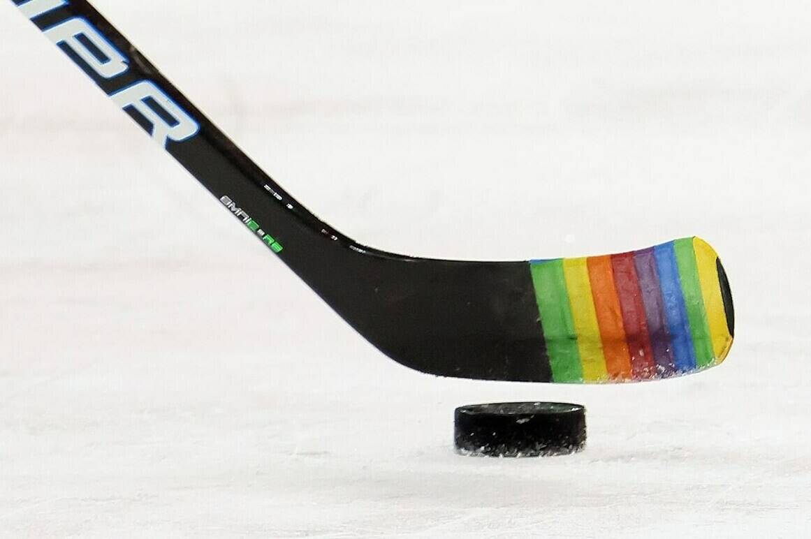 Zac Jones of the New York Rangers skates with a stick decorated for “Pride Night” in warm-ups prior to the game against the Washington Capitals, in New York City, Monday, May 3, 2021.NHL players refusing to participate in Pride nights around the league shows hockey still isn’t safe for a number of LGBTQ people, says one of the first male professional players to publicly come out as gay. THE CANADIAN PRESS/AP-Bruce Bennett, POOL