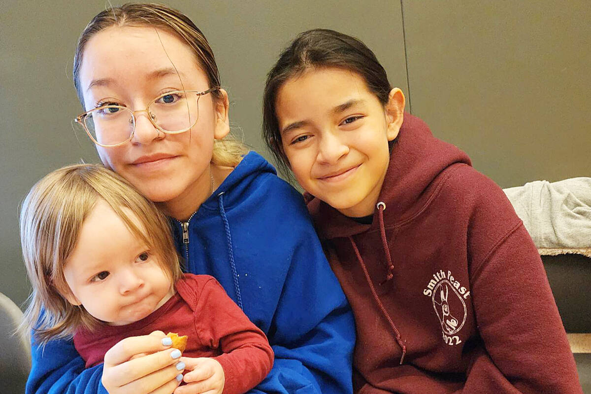 From left: λugʷaləs, Janine and Raven Shaw share a happy moment. Their parents Crystal Smith and Raymond Shaw were successful in getting B.C.’s Vital Statistics Agency to put λugʷaləs’ proper name on his birth certificate. Shaw family photograph