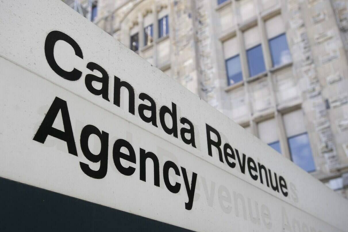 A sign outside the Canada Revenue Agency is seen Monday May 10, 2021 in Ottawa. The Canada Revenue Agency will pilot a new automatic tax filing system next year to help vulnerable Canadians who don’t file their taxes get the benefits to which they’re entitled. THE CANADIAN PRESS/Adrian Wyld