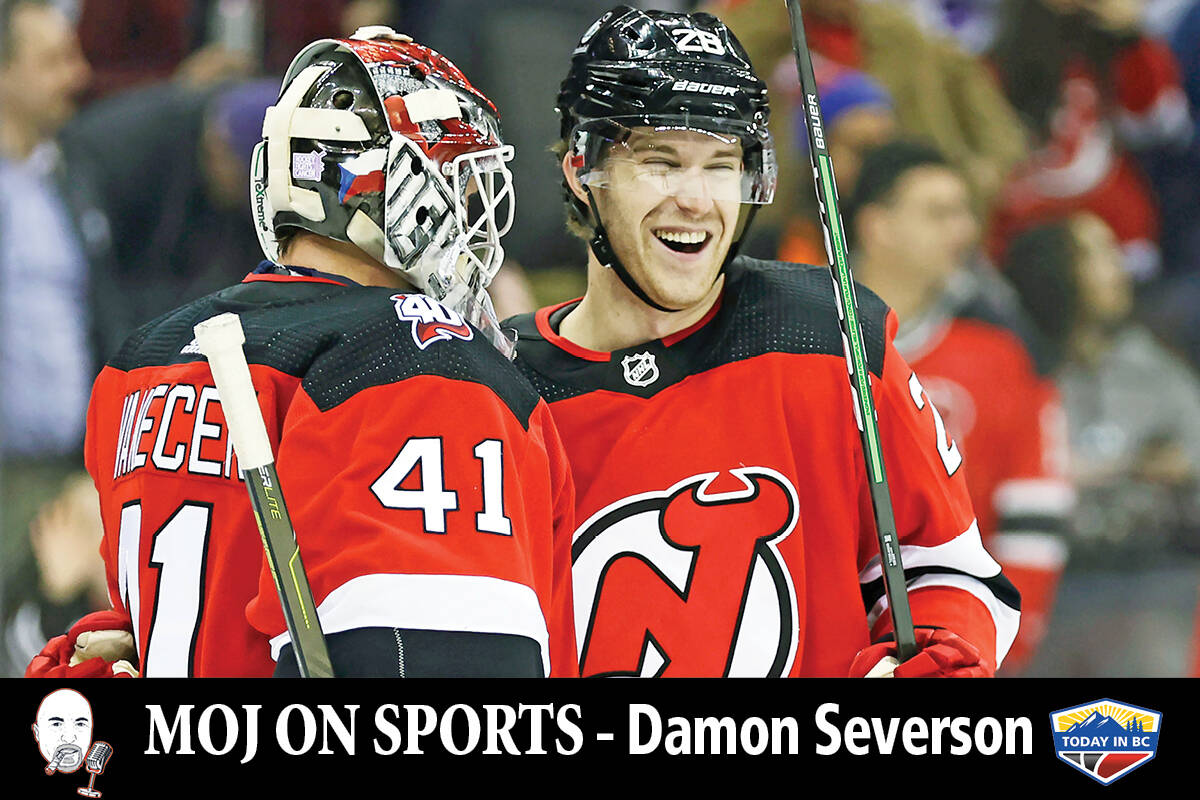 New Jersey Devils goaltender Vitek Vanecek (41) and Damon Severson celebrate after defeating the Edmonton Oilers. (AP Photo/Adam Hunger)