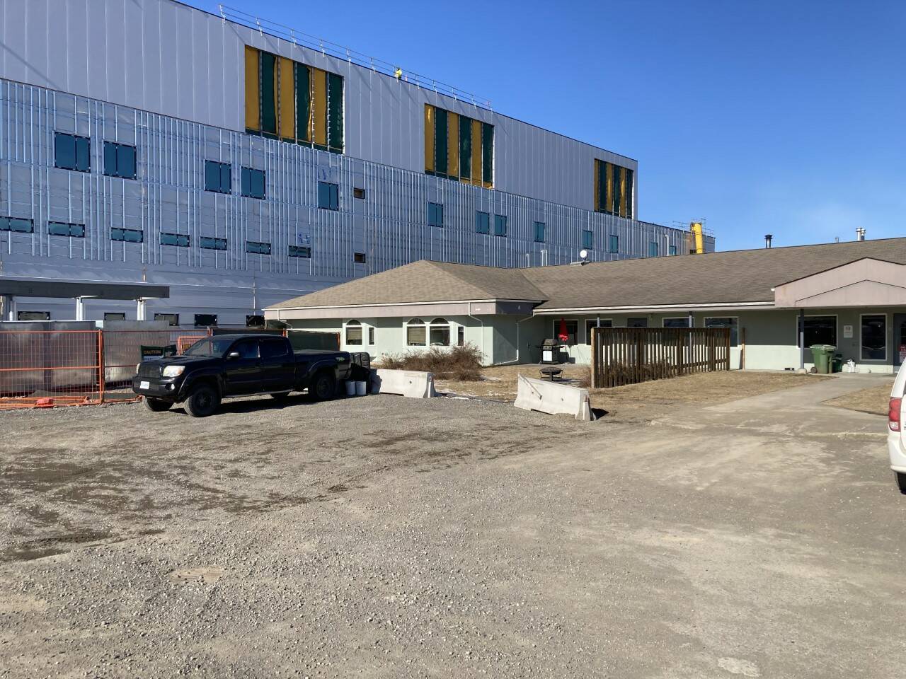 The new Mills Memorial Hospital now under construction looms close to the current Seven Sisters mental health facility which is scheduled to be demolished. (Staff photo)
