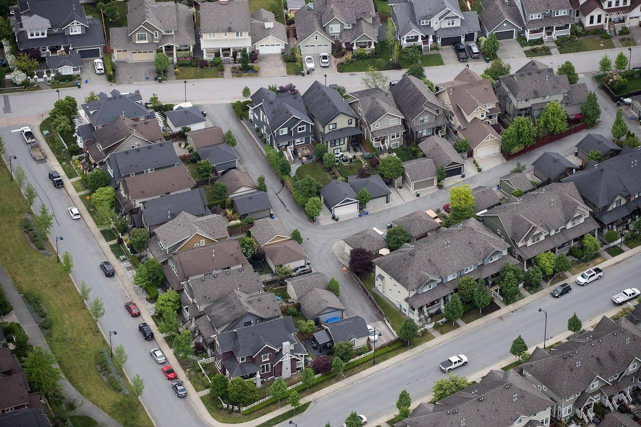 Houses and townhouses are seen in an aerial view in Langley, B.C. A new plan announced Monday promises to create more density in areas currently zoned single-residential. THE CANADIAN PRESS/Darryl Dyck