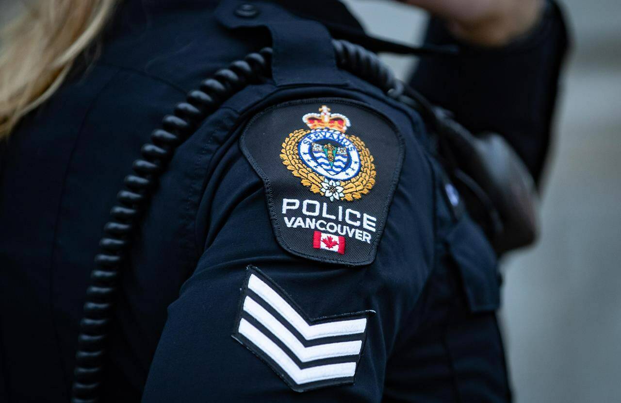 A Vancouver Police Department patch is seen on an officer’s uniform in the Downtown Eastside of Vancouver, on Jan. 9, 2021. Vancouver police say they are investigating “violent confrontations” at a rally marking the International Transgender Day of Visibility on Friday. THE CANADIAN PRESS/Darryl Dyck