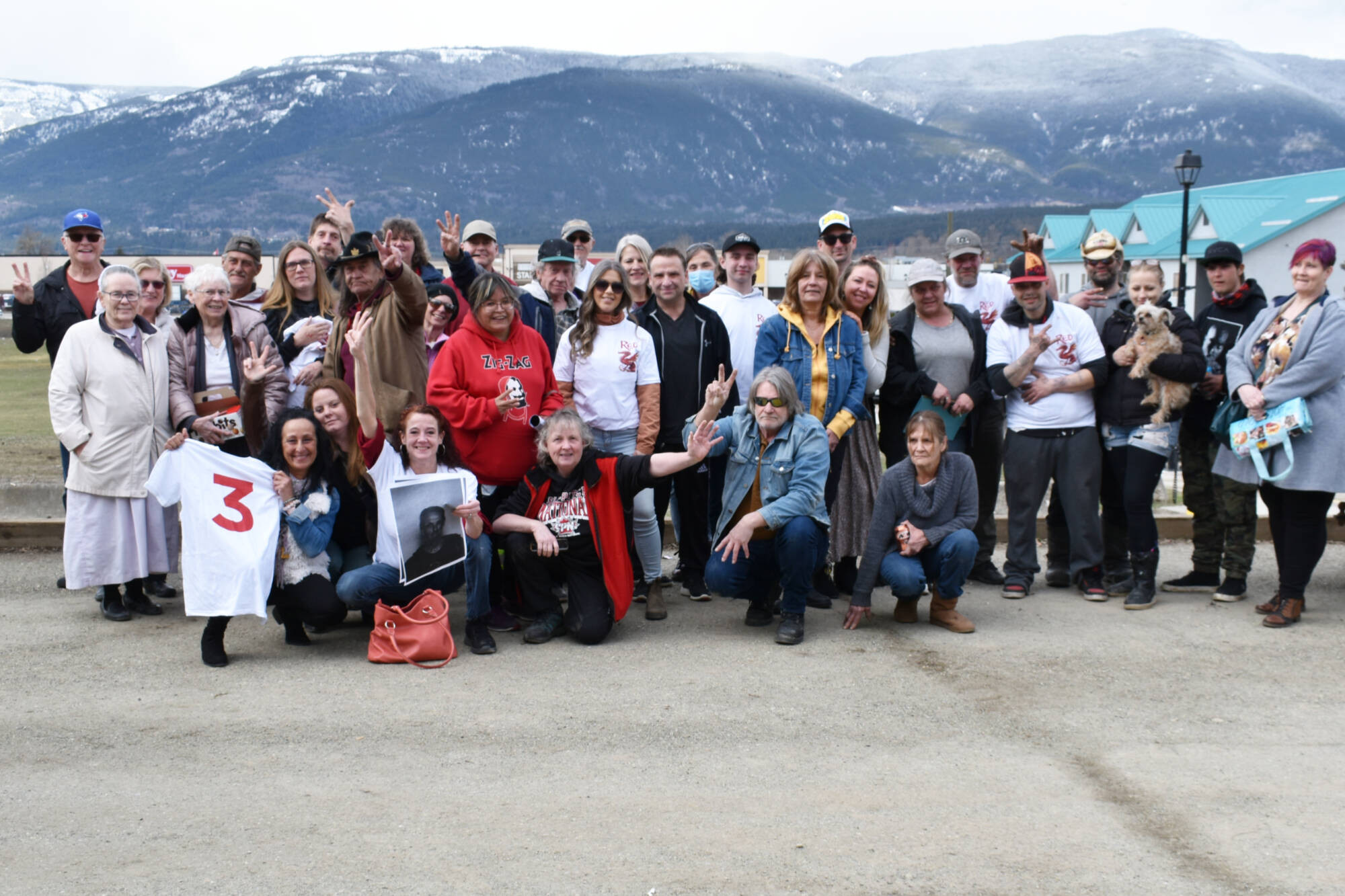 Some members of the group of about 50 people who attended the memorial for Rob Konkle on April 1, 2023 in Salmon Arm took time out for a photo. (Martha Wickett-Salmon Arm Observer)