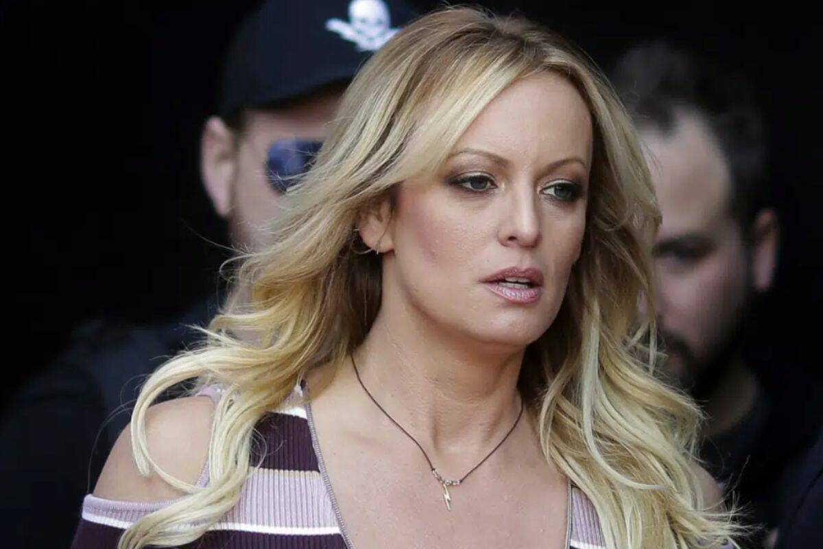 FILE - Adult film actress Stormy Daniels arrives for the opening of the adult entertainment fair Venus in Berlin, Oct. 11, 2018. An appeals court ruled Tuesday, April 4, 2023, that Daniels must pay nearly $122,000 of Donald Trump's legal fees that were racked up in connection with the porn actor's failed defamation lawsuit. The ruling in Los Angeles came as Trump also faced a criminal case related to alleged hush money he paid to Daniels and another woman who claimed he had affairs with them. (AP Photo/Markus Schreiber, File)