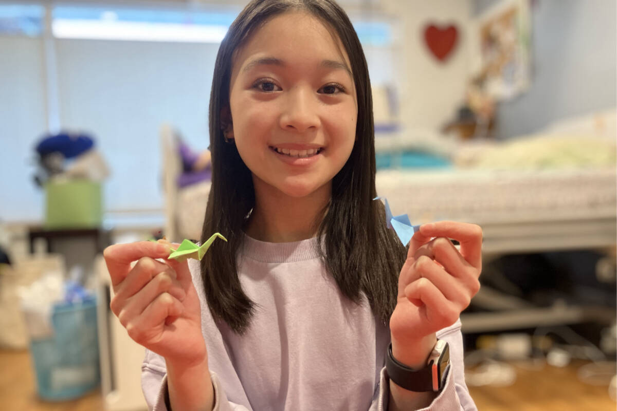 Saanich teen Myla Bui folds cranes in the thousands to help raise funds and spirits with the Help Fill a Wish Foundation. (Christine van Reeuwyk/News Staff)