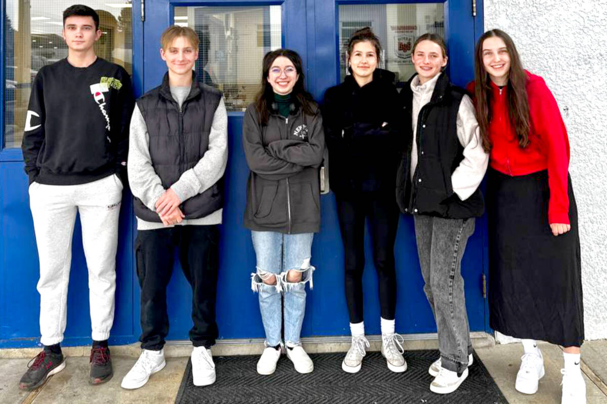 (L-R) Tim, Makar, Brynn, Talia, Vera Gileff, and Antonina Kozelets are some of the Maple Ridge Christian School students who have come together to offer Ukrainian refugees free ESL classes every Thursday. (Maple Ridge Christian School/Special to The News)