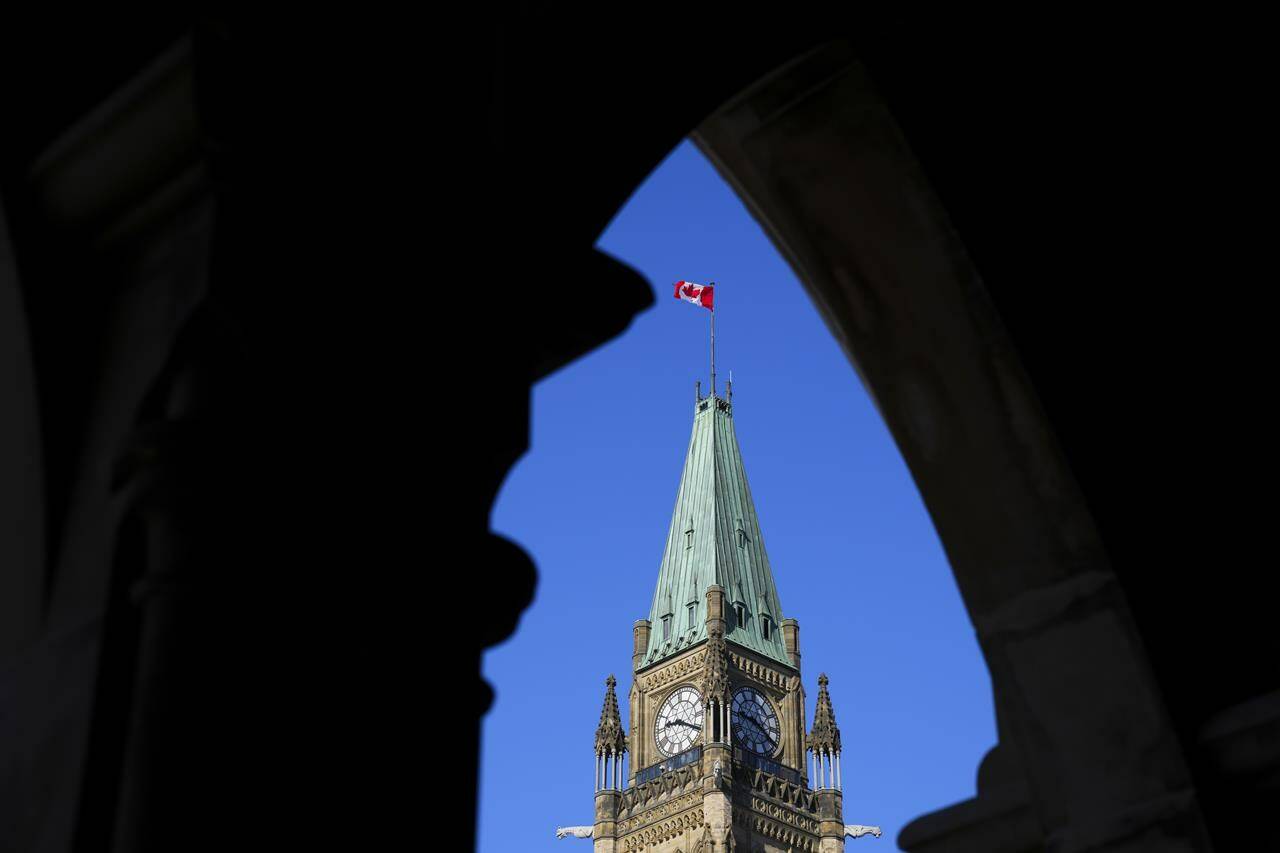 The Canadian flag flies on top of the Peace Tower on Parliament Hill in Ottawa on Monday, March 6, 2023. THE CANADIAN PRESS/Sean Kilpatrick