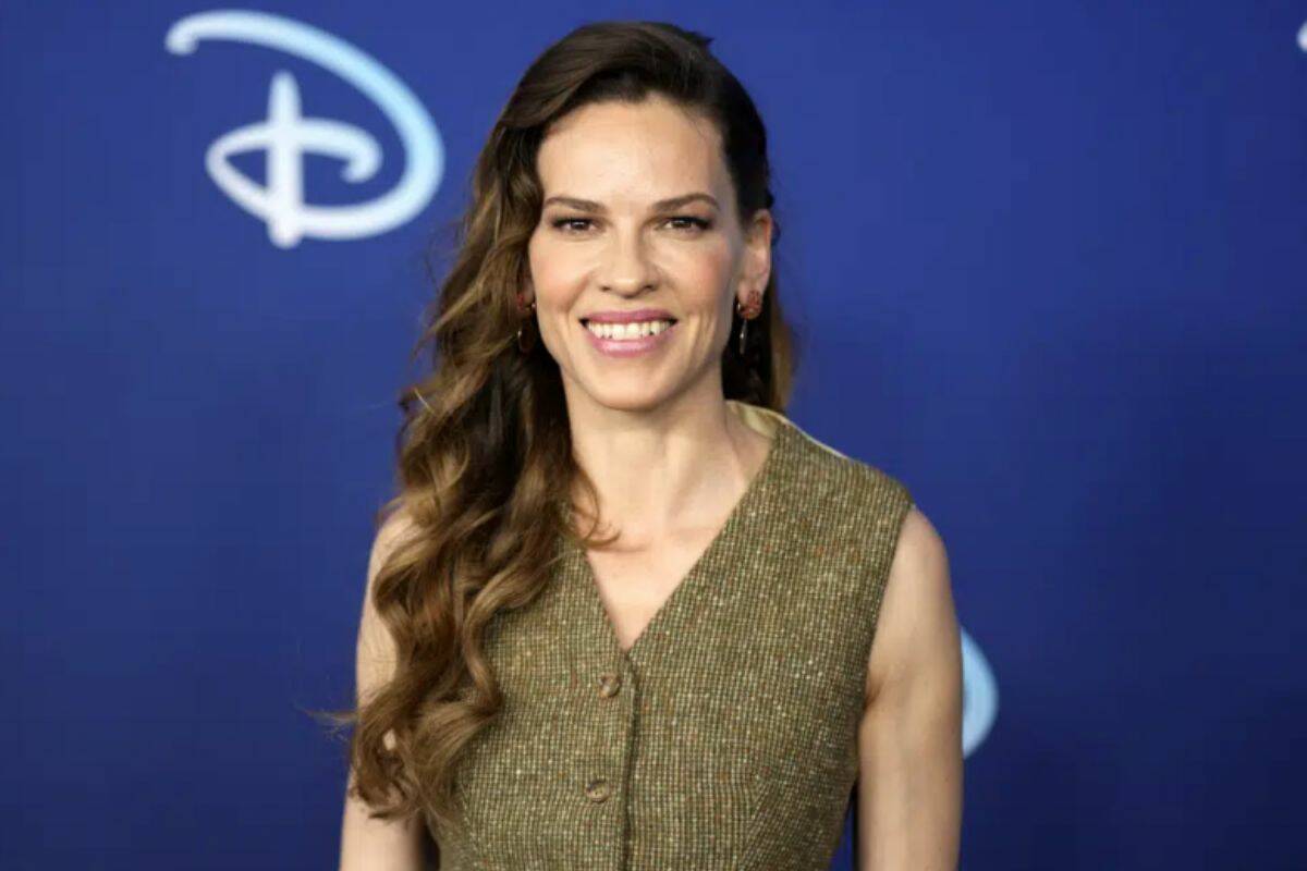 FILE - Hilary Swank attends the Disney 2022 Upfront presentation at Basketball City Pier 36 on Tuesday, May 17, 2022, in New York. Swank has given birth to twins — a boy and a girl. The 48-year-old “Million Dollar Baby” actor posted a photo of her and her twins looking at the sunset on Instagram Sunday. (Photo by Charles Sykes/Invision/AP, File)