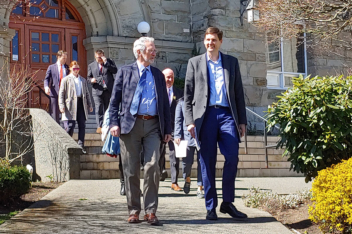 Nanaimo Mayor Leonard Krog speaks with B.C. Premier David Eby outside Nanaimo Courthouse on Wednesday, April 12, before a government announcement about 12 new hubs dedicated to targeting repeat violent offenders. (Chris Bush/News Bulletin)
