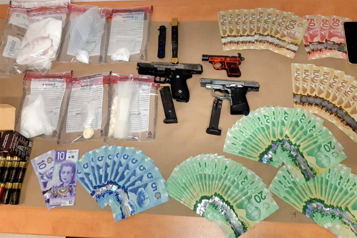Cash, firearms, drugs and ammunition were found in a brown Jeep during a routine patrol stop in Abbotsford on April 11. (Abbotsford Police photo)