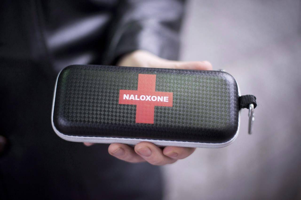 A naloxone anti-overdose kit is held in downtown Vancouver, B.C., Friday, Feb. 10, 2017. British Columbia Emergency Health Services has released grim statistics on the toxic drug crisis ahead of the seventh anniversary of the province declaring a public health emergency. THE CANADIAN PRESS/Jonathan Hayward
