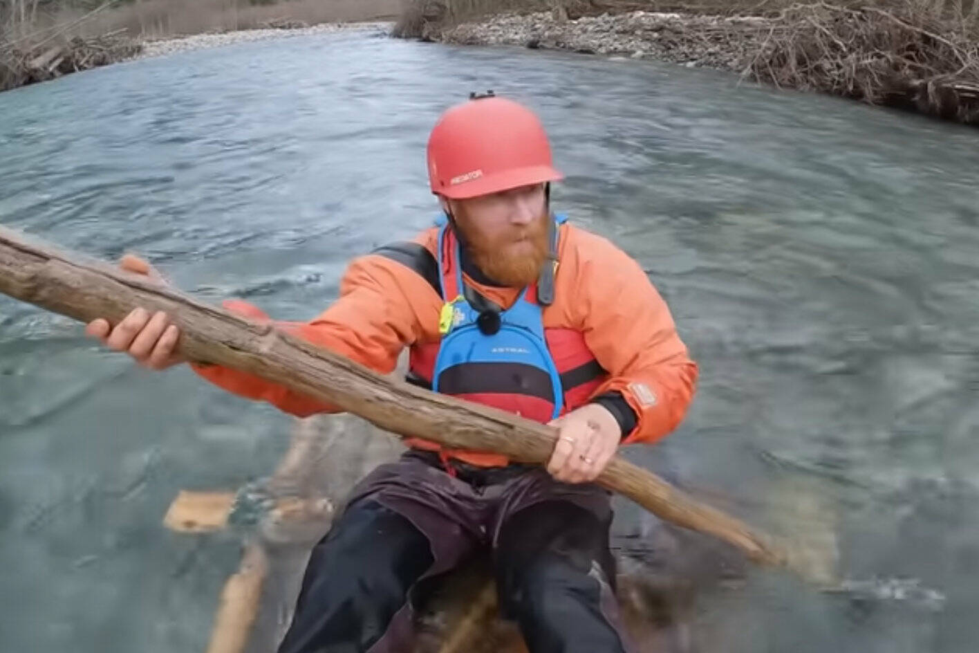 Video still from Australian YouTuber Beau Miles building a raft out of downed trees before floating down the Chilliwack River. (YouTube)