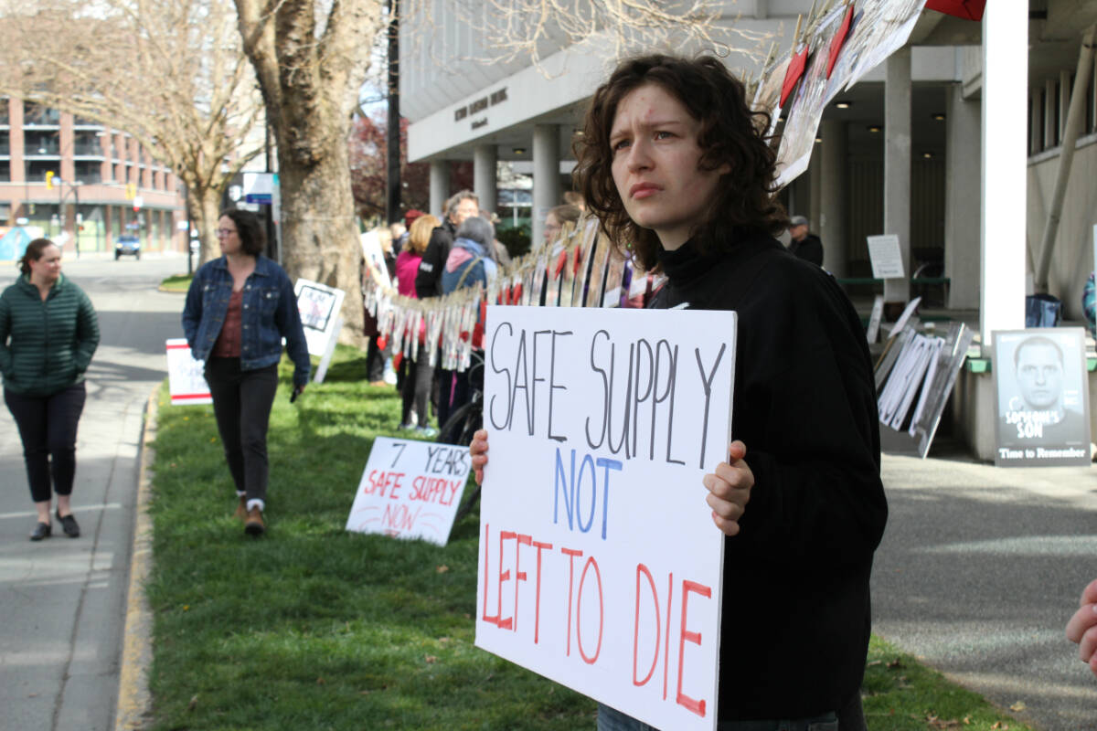 Safe supply advocates hold a rally outside the B.C. Ministry of Health in downtown Victoria April 14. The day marks seven years since the province declared the overdose public health emergency. (Austin Westphal/News Staff)