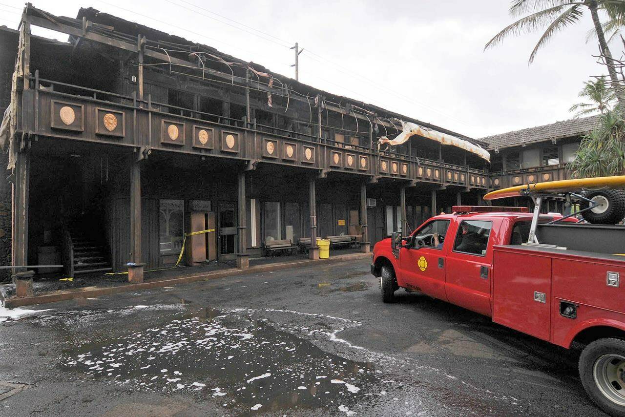 FILE - The Coco Palms Resort retail annex where one shop on the second floor was gutted by fire in Wailua on the island of Kauai, Hawaii, is pictured on Dec. 3, 2009. Demolition will soon begin on the resort once favored by both Hawaiian and Hollywood royalty before it was heavily damaged by a hurricane three decades ago. The Honolulu Star-Advertiser reports the Coco Palms Resort on the island of Kauai will be torn down for a new 350-room hotel. Construction is expected to take about three years. (Dennis Fujimoto/The Garden Island via AP, File)