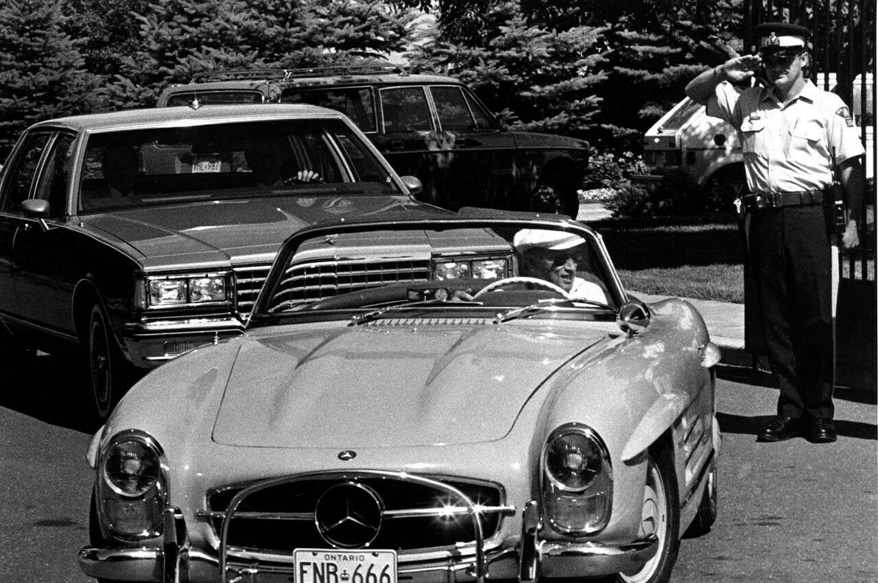 Former Prime Minister Pierre Trudeau gets a final slaute from RCMP guard as he leaves 24 Sussex Dr. June 30, 1984 after resigning as prime minister. Trudeau drove his Mercedes sports car to Harrington Lake for the weekend. With threats against Prime Minister Justin Trudeau spiking in recent years, newly released historical records reveal the security concerns the RCMP had when his father was getting ready to leave office. THE CANADIAN PRESS/Andrew Vaughan