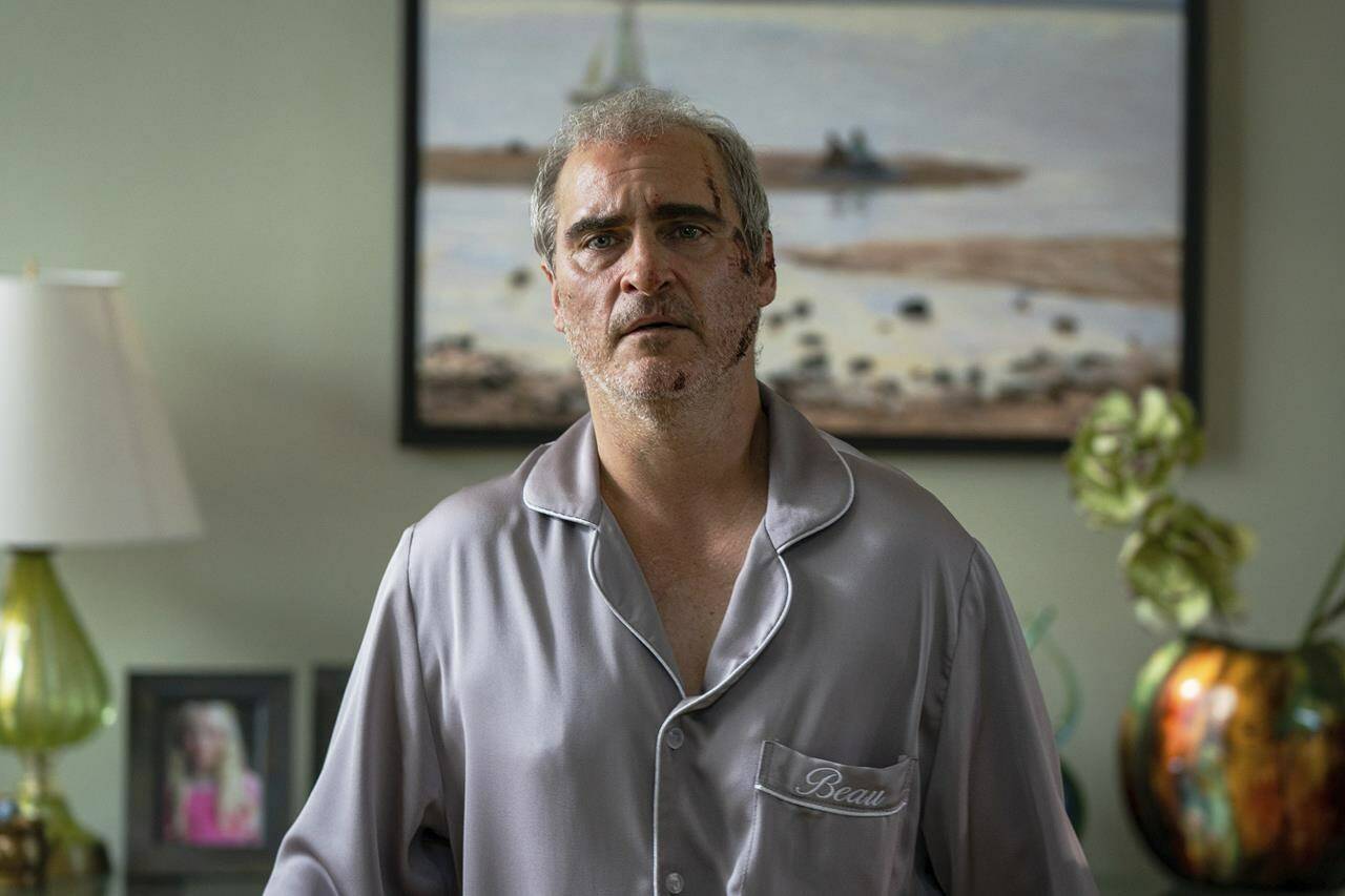 This image released by A24 shows Joaquin Phoenix in a scene from “Beau is Afraid.” (Takashi Seida/A24 via AP)