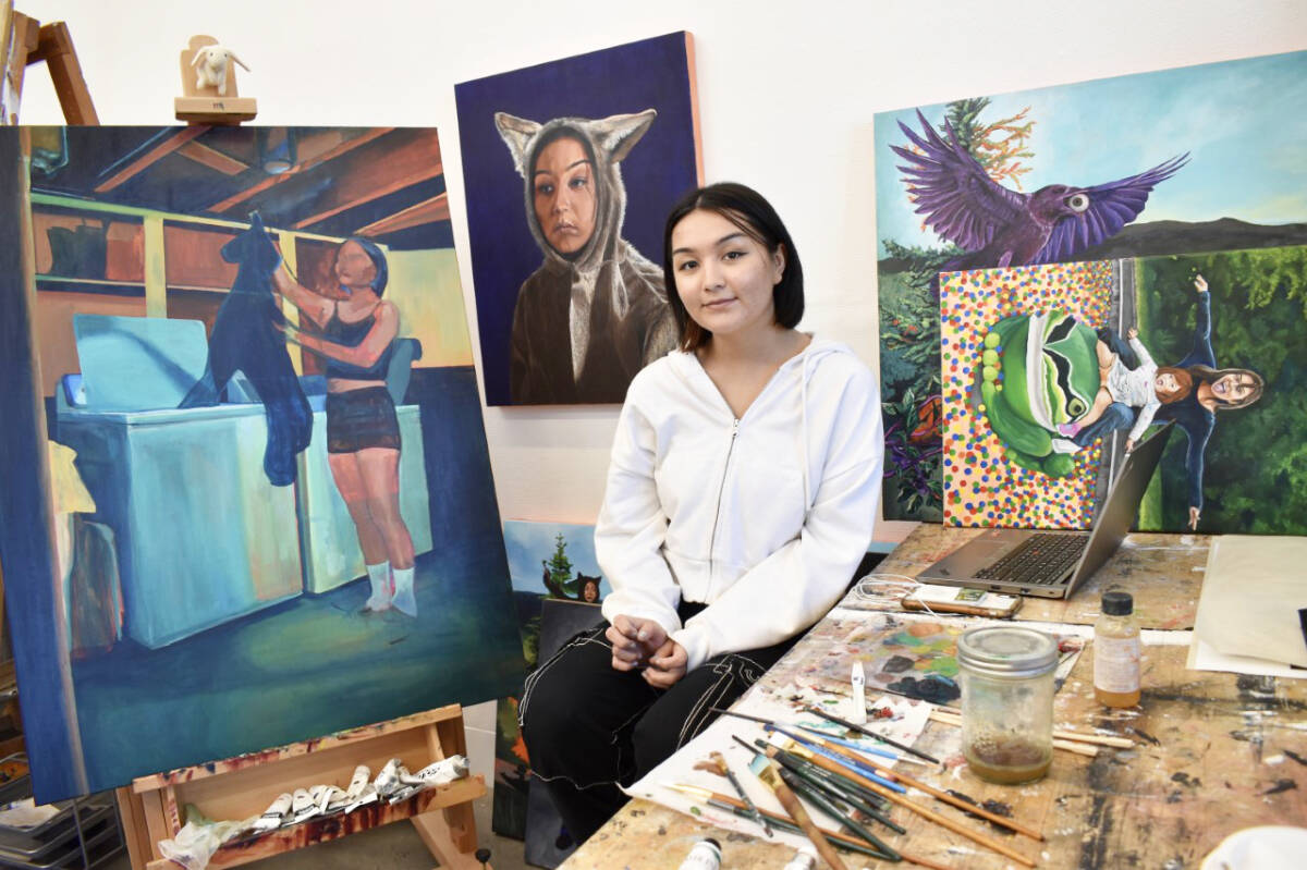 Michaela Gilbert, a young WLFN artist studying fine arts at the University of Victoria, in her studio space with some of her artwork. (Satya Underhill Garcia)