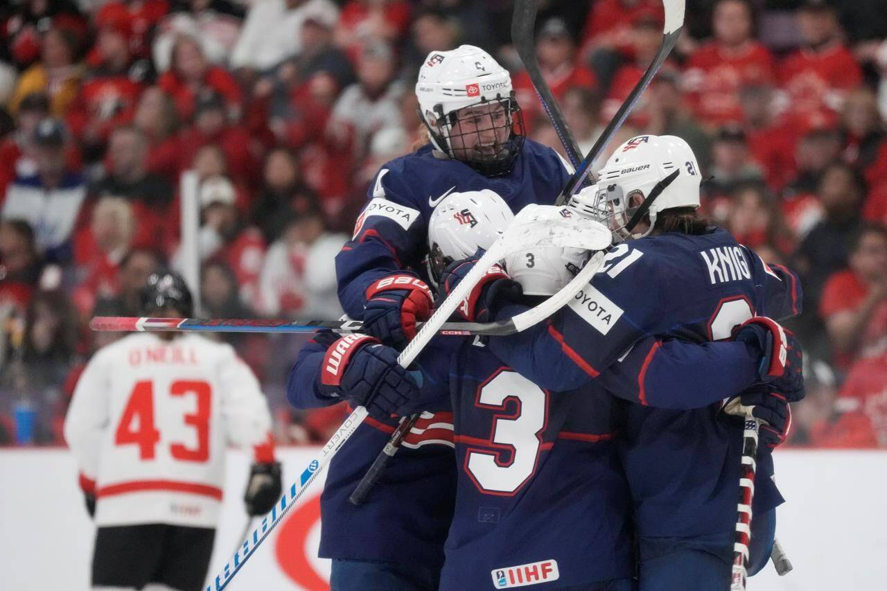 USA players celebrate after winning the IIHF Women’s World Hockey Championship gold medal game against the Canada in Brampton, Ont., on Sunday, April 16, 2023. THE CANADIAN PRESS/Frank Gunn