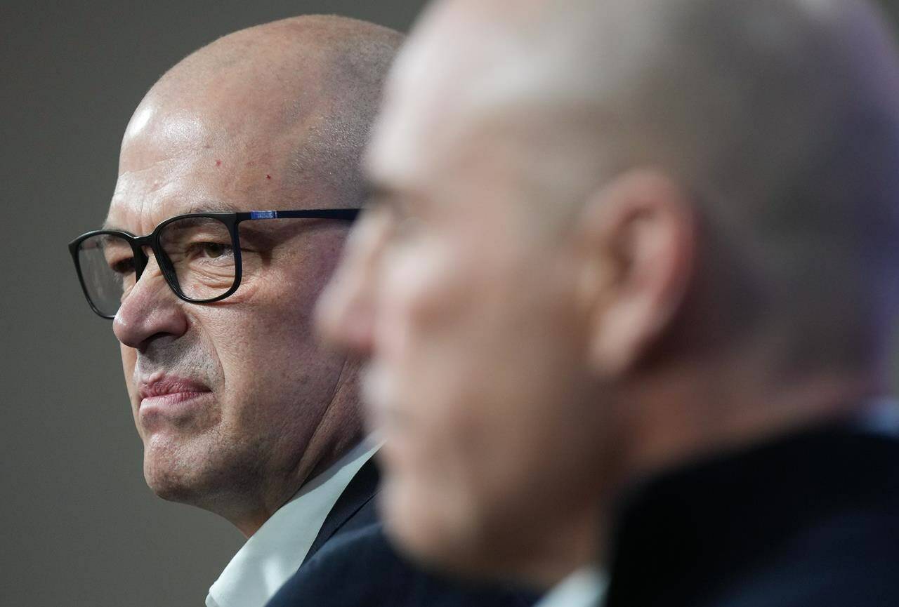 Vancouver Canucks general manager Patrik Allvin, back left, and head coach Rick Tocchet listen during the NHL hockey team’s end of season news conference, in Vancouver, on Monday, April 17, 2023. THE CANADIAN PRESS/Darryl Dyck