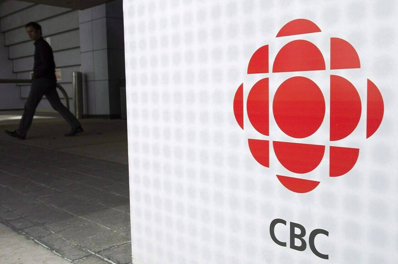 A man leaves the CBC building in Toronto on Wednesday, April 4, 2012. One of CBC’s Twitter accounts now has a label which describes the broadcaster as “Government-funded Media.” THE CANADIAN PRESS/Nathan Denette