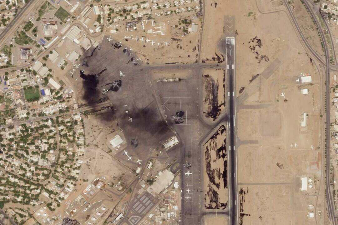 This satellite photo from Planet Labs PBC shows damaged aircraft, including one on fire, at Khartoum International Airport in Khartoum, Sudan, Monday, April 17, 2023. Satellite images from Planet Labs PBC analyzed Tuesday by The Associated Press show the extent of the destruction from days of fighting in Sudan between rival military forces, including some 20 aircraft either damaged or destroyed at Khartoum’s airport. (Planet Labs PBC via AP)