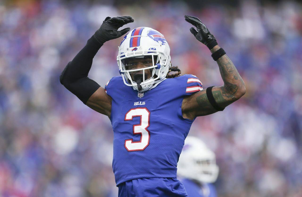 FILE - Buffalo Bills safety Damar Hamlin reacts after a play during the first half of the team’s NFL football game against the Pittsburgh Steelers on Oct. 9, 2022, in Orchard Park, Hamlin has been cleared to resume playing and is attending the team’s voluntary workout program some four months after going into cardiac arrest and having to be resuscitated on the field during a game at Cincinnati, general manager Brandon Beane said Tuesday, April 18, 2023. (AP Photo/Joshua Bessex, File)