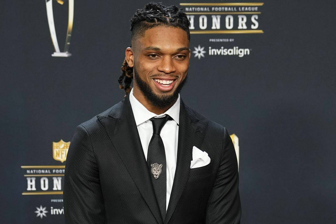 FILE - Buffalo Bills Damar Hamlin arrives for the NFL Honors award show ahead of the Super Bowl 57 football game, Thursday, Feb. 9, 2023, in Phoenix. Hamlin has been cleared to resume playing and is attending the team’s voluntary workout program some four months after going into cardiac arrest and having to be resuscitated on the field during a game at Cincinnati, general manager Brandon Beane said Tuesday, April 18, 2023. (AP Photo/Matt York, File)