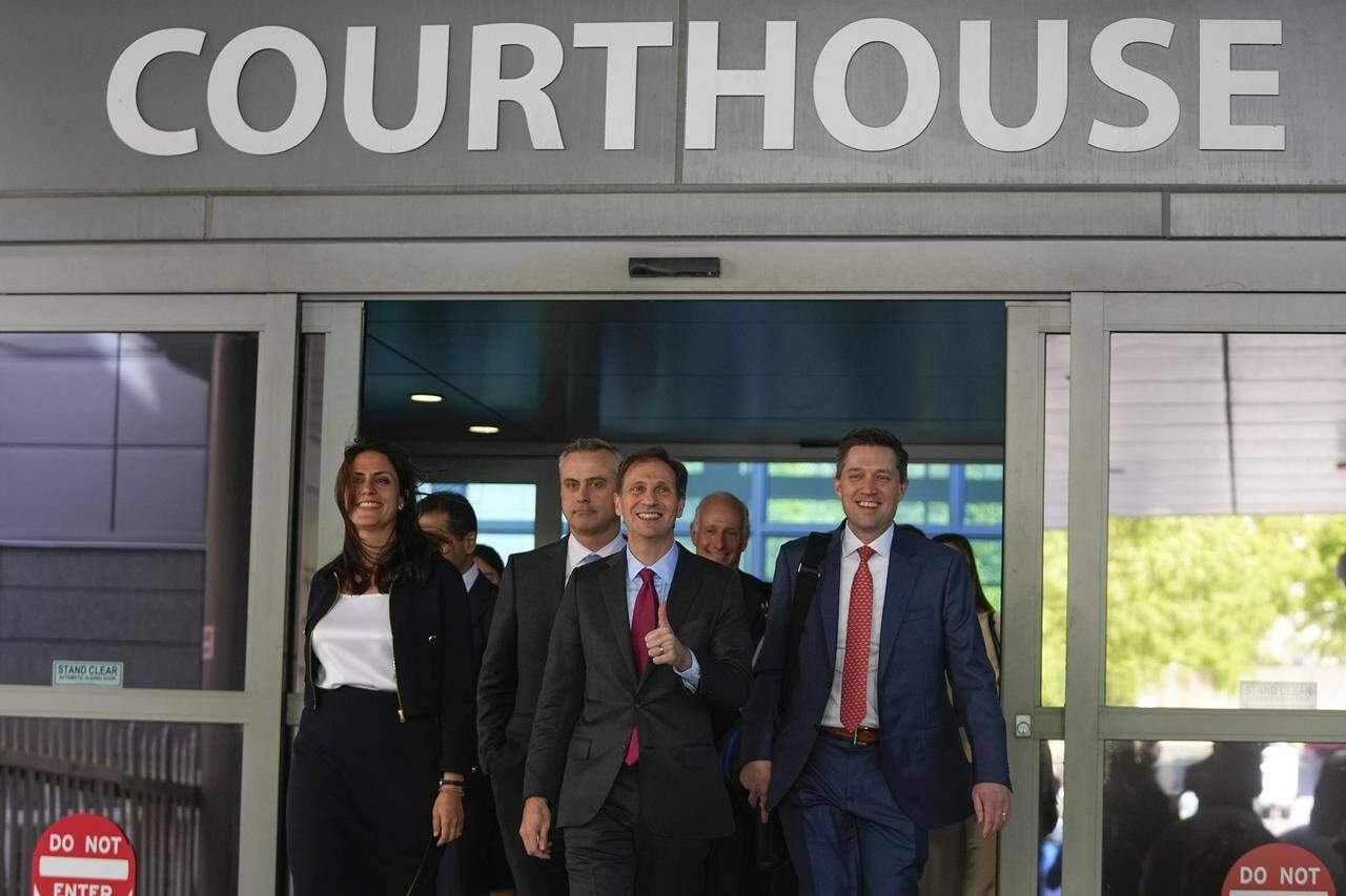 Davida Brook, left, Justin Nelson, center, and Stephen Shackelford, right, attorneys for Dominion Voting Systems, exit the New Castle County Courthouse in Wilmington, Del., after the defamation lawsuit by Dominion Voting Systems against Fox News was settled just as the jury trial was set to begin, Tuesday, April 18, 2023. (AP Photo/Julio Cortez)