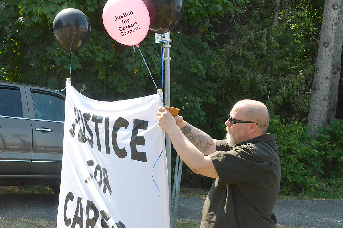 Carson’s father Aron Crimeni put balloons on the Justice For Carson banner at the Walnut Grove Skate Park on Friday, July 2, 2021. (Langley Advance Times files)